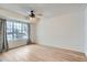 Bright bedroom featuring hardwood floors and large window at 12136 E 2Nd Dr, Aurora, CO 80011