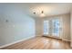 Dining area with wood-look floors and access to a patio at 12136 E 2Nd Dr, Aurora, CO 80011