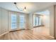 Dining room with wood-look floors and access to the living room at 12136 E 2Nd Dr, Aurora, CO 80011