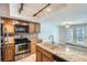 Kitchen with island, stainless steel appliances, granite counters at 12136 E 2Nd Dr, Aurora, CO 80011