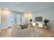 Living room with light beige sofa and a large TV at 12136 E 2Nd Dr, Aurora, CO 80011