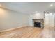 Living room featuring a stone fireplace and light flooring at 12136 E 2Nd Dr, Aurora, CO 80011