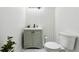 Stylish basement bathroom with green vanity and hexagon tile floor at 6112 Black Mesa Rd, Frederick, CO 80516