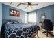 Bedroom with a queen-size bed and built-in desk area at 6112 Black Mesa Rd, Frederick, CO 80516