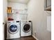 Laundry room with washer, dryer, and overhead storage at 6112 Black Mesa Rd, Frederick, CO 80516