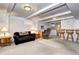 Spacious finished basement offering a cozy seating area and a functional bar area at 6365 S Valleyview St, Littleton, CO 80120