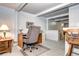 Functional basement office space with wooden desk, office chair, and natural light at 6365 S Valleyview St, Littleton, CO 80120