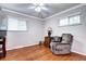Inviting bedroom with hardwood floors, a recliner, and lots of natural light from the windows at 6365 S Valleyview St, Littleton, CO 80120