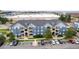 Aerial view of a residential apartment complex with ample parking, landscaping, and manicured lawns at 4451 S Ammons St # 5-307, Littleton, CO 80123