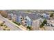 Overhead view of a multi-unit apartment complex featuring manicured grounds, nearby parking, and a residential setting at 4451 S Ammons St # 5-307, Littleton, CO 80123