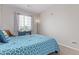 Comfortable bedroom with neutral carpet, and a desk under a window for plenty of light at 4451 S Ammons St # 5-307, Littleton, CO 80123