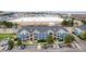 Blue apartment building featuring well-maintained landscaping and convenient parking at 4451 S Ammons St # 5-307, Littleton, CO 80123