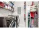 Convenient laundry room including modern Samsung washer and dryer, shelving, and storage solutions at 4451 S Ammons St # 5-307, Littleton, CO 80123