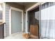 Outdoor patio featuring sliding glass door, an entry door, and a relaxing seating area at 4451 S Ammons St # 5-307, Littleton, CO 80123