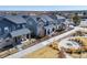 View of new homes along walkway with wrought iron fence, landscaping, and community area at 9080 W 100Th Way, Broomfield, CO 80021