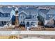 Exterior elevation aerial view of home with front porch and fenced front yard at 9080 W 100Th Way, Broomfield, CO 80021