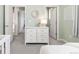 Neutral toned bedroom with a white dresser, offering ample storage, and a view into the hall and closet at 9080 W 100Th Way, Broomfield, CO 80021