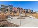 Open community space featuring benches and landscaping with neighborhood homes at 9080 W 100Th Way, Broomfield, CO 80021