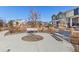 Community common area with benches, landscaping and neighborhood homes at 9080 W 100Th Way, Broomfield, CO 80021