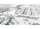 Winter aerial view of community showcasing a creek running through a neighborhood at 19473 W 58Th Pl, Golden, CO 80403