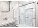 Modern bathroom featuring sleek subway tile shower, vanity, and brushed nickel fixtures at 19473 W 58Th Pl, Golden, CO 80403