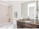 Bathroom featuring granite countertops and a tiled shower-tub combination at 19473 W 58Th Pl, Golden, CO 80403