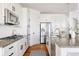 Well-equipped kitchen with stainless steel appliances, granite countertops, and a stylish backsplash at 19473 W 58Th Pl, Golden, CO 80403