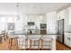 Stylish kitchen with a large island, modern pendant lighting, and stainless steel appliances at 19473 W 58Th Pl, Golden, CO 80403