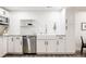 Kitchen featuring granite countertops, stainless steel appliances, and white cabinetry at 19473 W 58Th Pl, Golden, CO 80403