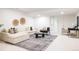 Cozy living room featuring neutral furniture, contemporary decor, and a rug at 19473 W 58Th Pl, Golden, CO 80403