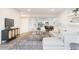 Spacious living room featuring neutral furniture, contemporary decor, and a rug at 19473 W 58Th Pl, Golden, CO 80403