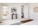 Bright main bedroom with an exterior door, and a view through to the living room at 19473 W 58Th Pl, Golden, CO 80403