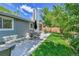 Beautiful backyard patio with comfortable seating and lush green grass offers a serene outdoor living space at 11788 E Atlantic Pl, Aurora, CO 80014