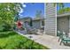 Relaxing backyard patio with outdoor seating, grill, and lush green lawn, perfect for entertaining at 11788 E Atlantic Pl, Aurora, CO 80014