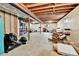 This unfinished basement with exposed ceiling beams provides ample room for customization and storage at 11788 E Atlantic Pl, Aurora, CO 80014