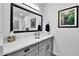 Bathroom featuring a vanity with white marble countertop, drawers and a framed mirror at 11788 E Atlantic Pl, Aurora, CO 80014