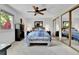 Bedroom with ceiling fan, neutral carpet, closet doors and view from the window at 11788 E Atlantic Pl, Aurora, CO 80014