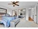 Bright bedroom with mirrored closet doors and neutral-toned carpet at 11788 E Atlantic Pl, Aurora, CO 80014