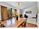 Dining room with wood floors and a view of the backyard and fireplace at 11788 E Atlantic Pl, Aurora, CO 80014