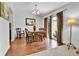 Bright dining room with wood floors, stylish furniture, and sliding door access to the outside at 11788 E Atlantic Pl, Aurora, CO 80014