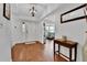 Inviting foyer showcasing hardwood floors, white walls, and a bright, airy ambiance at 11788 E Atlantic Pl, Aurora, CO 80014