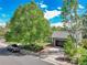 Aerial view of a beautiful home with a spacious driveway and mature trees surrounding the property at 11788 E Atlantic Pl, Aurora, CO 80014