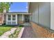 A welcoming entryway with a brick walkway, green grass, and light gray painted siding at 11788 E Atlantic Pl, Aurora, CO 80014