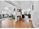 Open-concept living space with hardwood floors, and a view into the living room and kitchen at 11788 E Atlantic Pl, Aurora, CO 80014