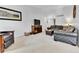 Spacious living room with neutral carpet, a media center, and comfortable seating at 11788 E Atlantic Pl, Aurora, CO 80014