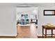 Bright living room with hardwood floors, white walls, and view into the living room at 11788 E Atlantic Pl, Aurora, CO 80014