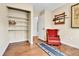 Office space with hardwood floors, red rocking chair, and closet for storage at 11788 E Atlantic Pl, Aurora, CO 80014