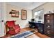 Spacious office with hardwood floors, window, desk, and a comfortable red rocking chair at 11788 E Atlantic Pl, Aurora, CO 80014