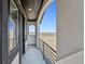 Balcony with black trim offering outdoor prairie views at 12450 Watkins Rd, Hudson, CO 80642