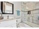 Bathroom with white vanity, modern faucet, and tiled shower-tub combination at 12450 Watkins Rd, Hudson, CO 80642